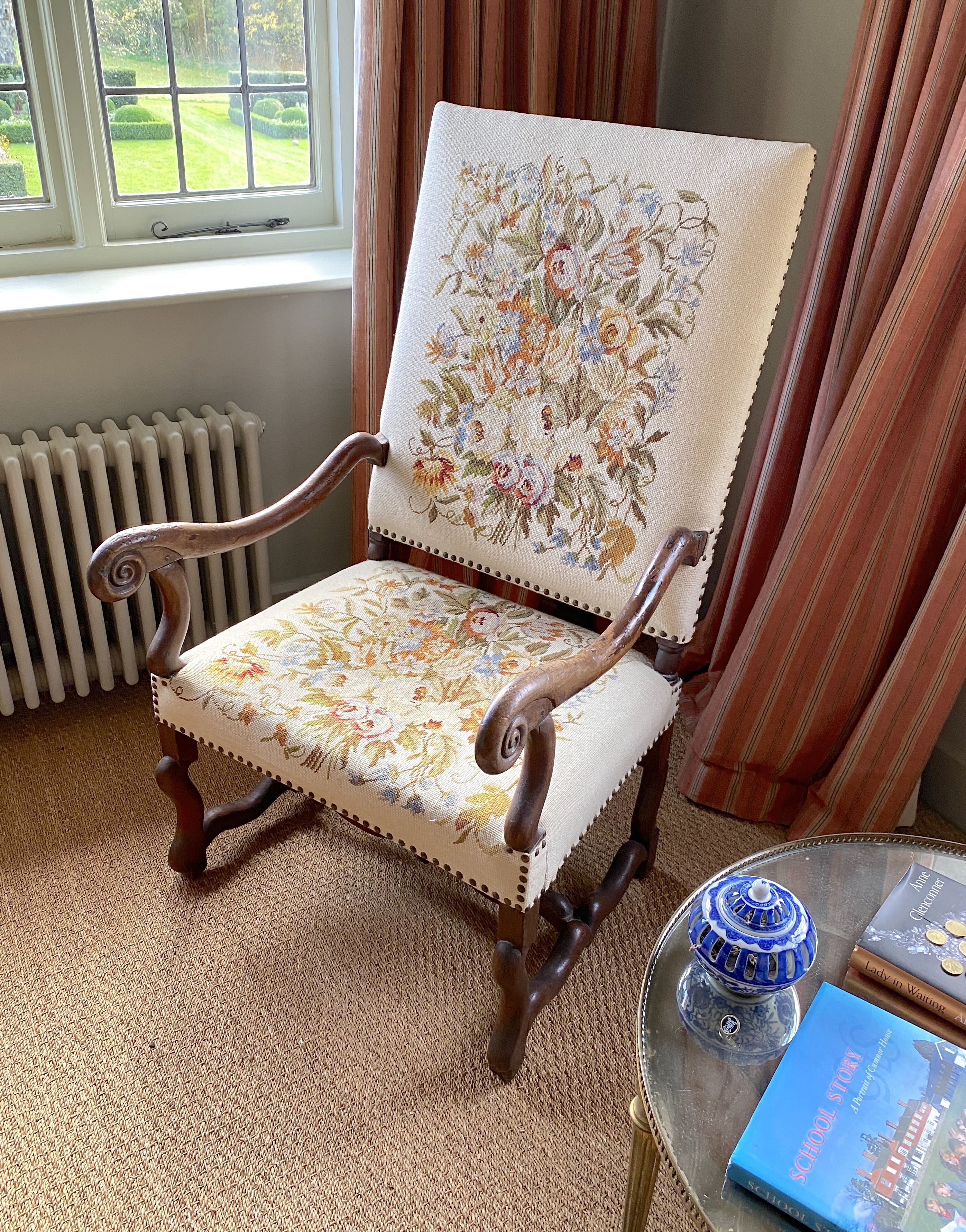 A 19th century French mahogany armchair, with later floral tapestry back and seat, width 65cm height 116cm